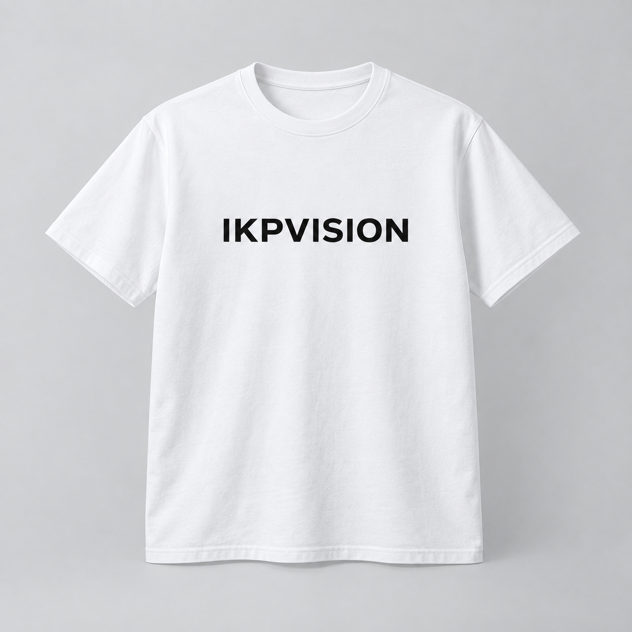 Concept mockup of a white IKPVISION T-shirt with a black chest wordmark